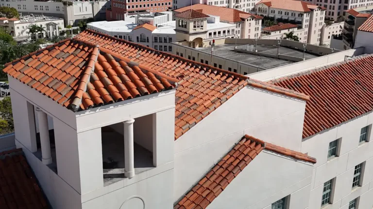 Close-up of a completed section of the clay tile roof after professional cleaning and maintenance at Hotel Colonnade.