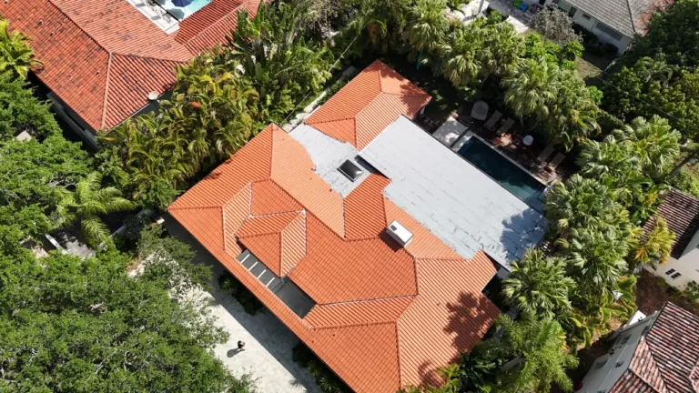 Panoramic drone shot showing the completed residential clay tile reroofing project for a luxury home in Coral Gables, FL.