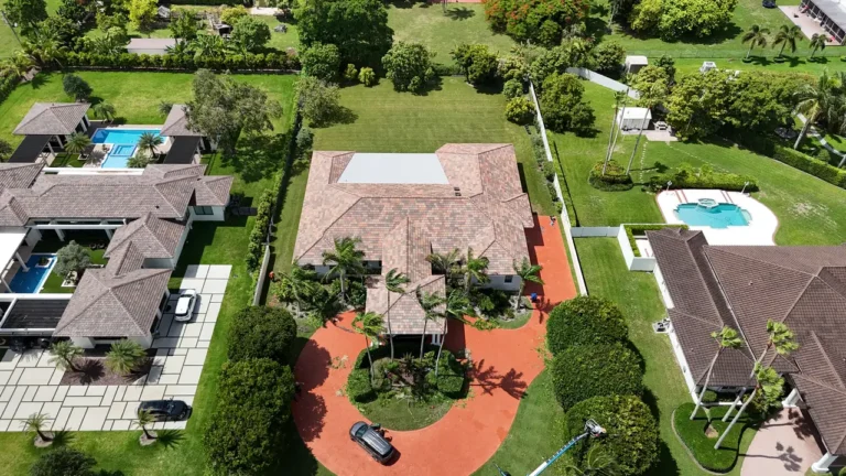 Shot of our professional roofing team performing preparation tasks on the roof of the Miami residence.